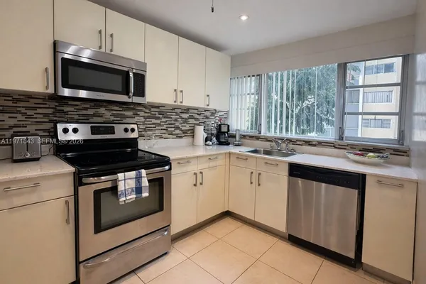 a kitchen with a stove and a microwave