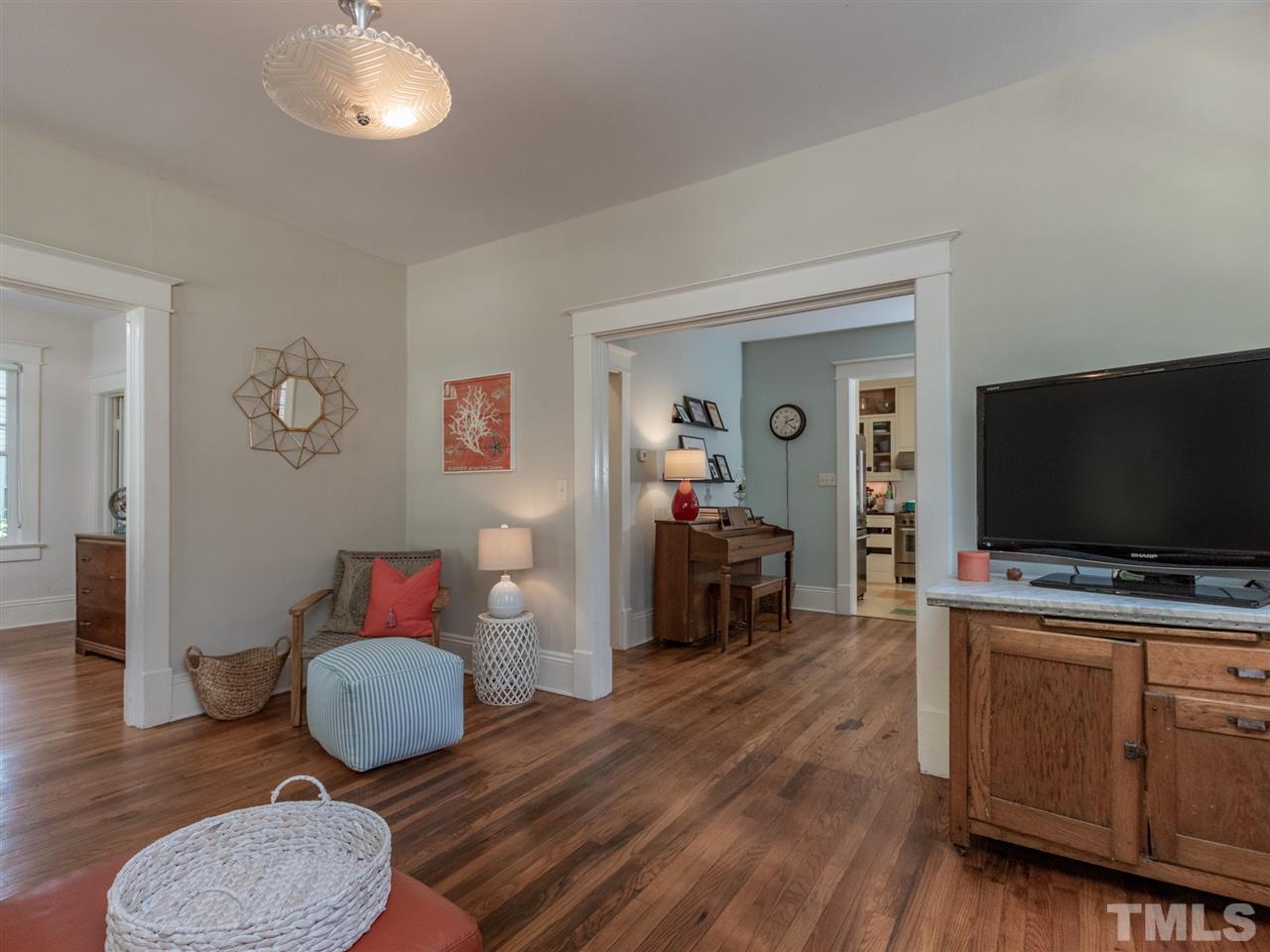 517 Washington Street Raleigh, NC 27605 - Photo 11 of 30 a living room with furniture and a flat screen tv