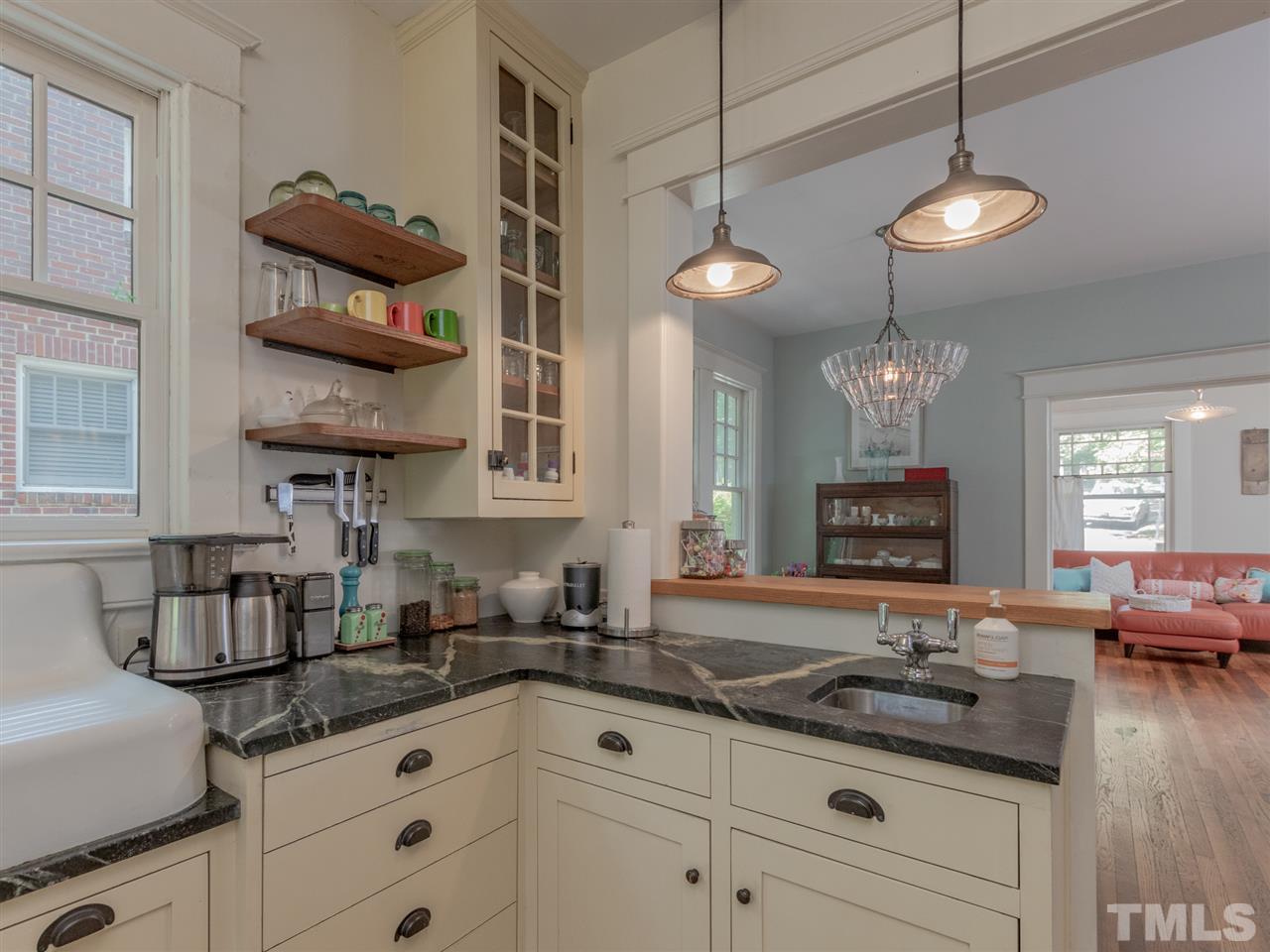 517 Washington Street Raleigh, NC 27605 - Photo 18 of 30 a kitchen with stainless steel appliances granite countertop a stove a sink and a cabinets