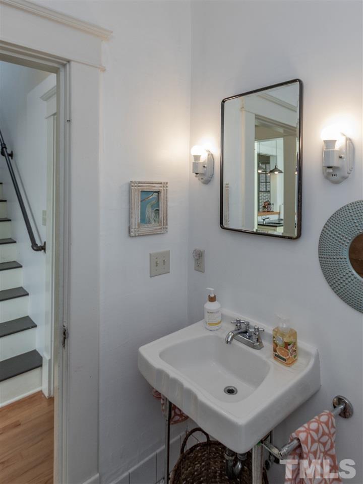 517 Washington Street Raleigh, NC 27605 - Photo 24 of 30 a bathroom with a sink and a mirror