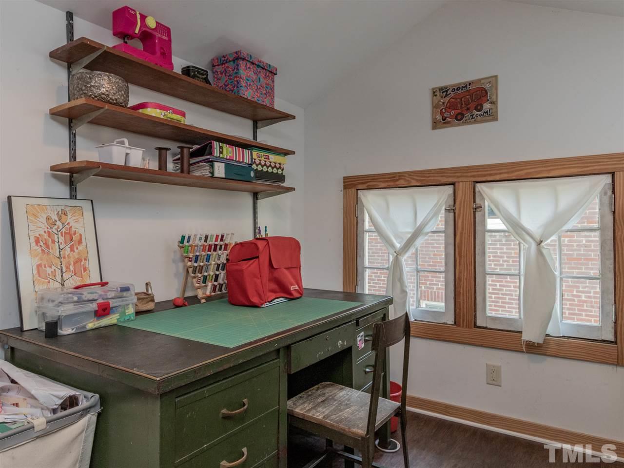 517 Washington Street Raleigh, NC 27605 - Photo 25 of 30 a room with a bed and a window
