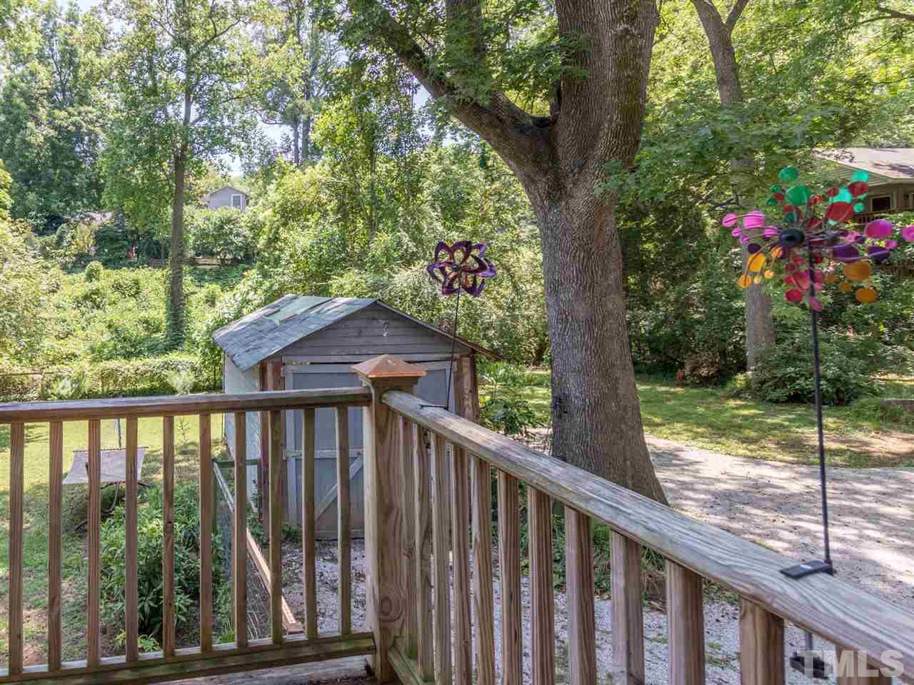 517 Washington Street Raleigh, NC 27605 - Photo 28 of 30 a view of a wooden deck next to a yard