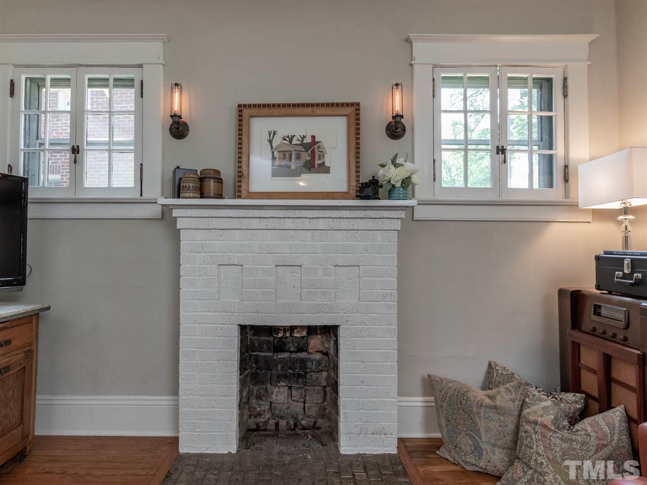 517 Washington Street Raleigh, NC 27605 - Photo 8 of 30 a living room with furniture and a fireplace