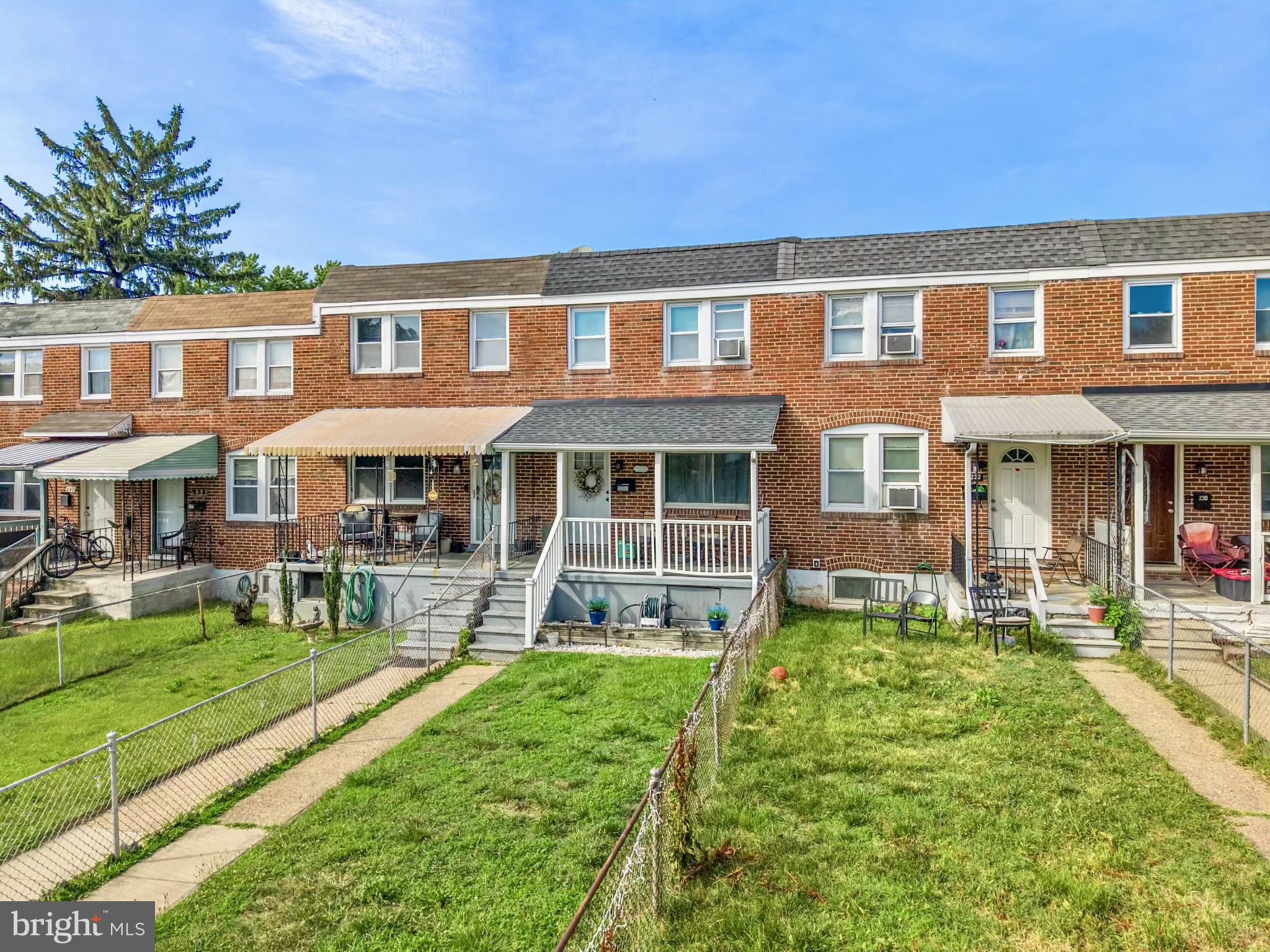234 West Edgevale Road Baltimore, MD 21225 - Photo 32 of 45 Charming brick townhomes with greenery.