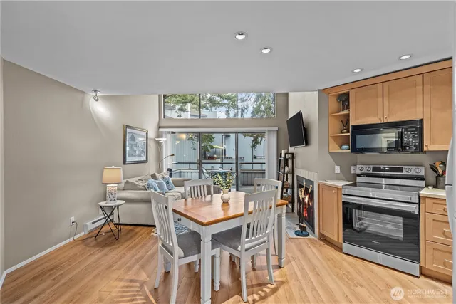 a view of a dining room with furniture window and wooden floor