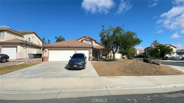 a view of a house with a street