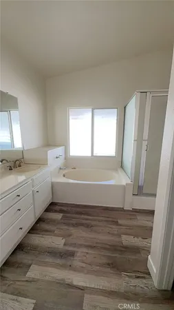 a view of a livingroom with wooden floor and closet