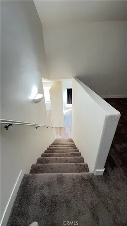 a view of an empty room with windows