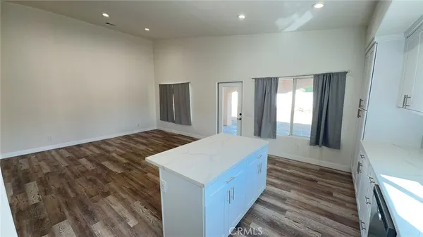 a view of room with wooden floor