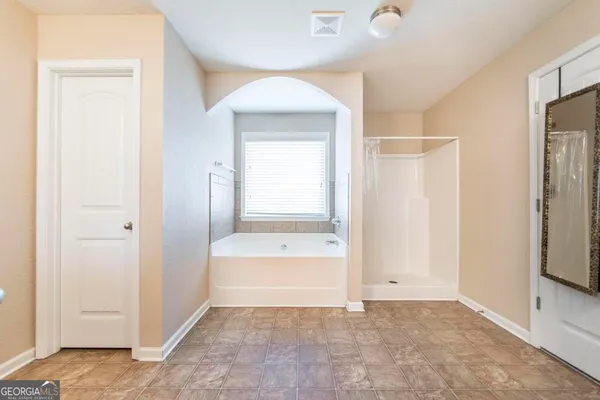 a bedroom with a bed and a table