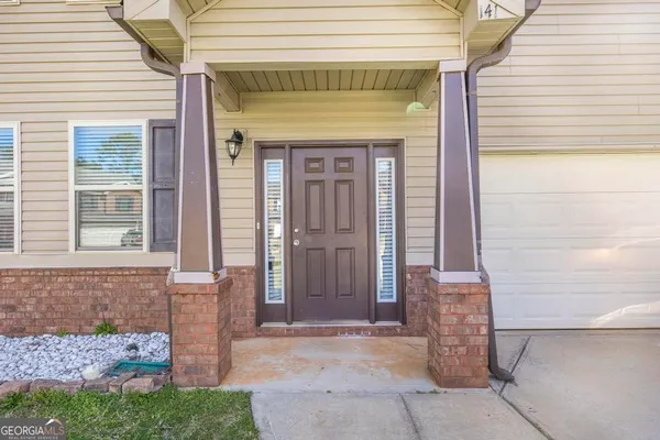 a front view of a house with a porch