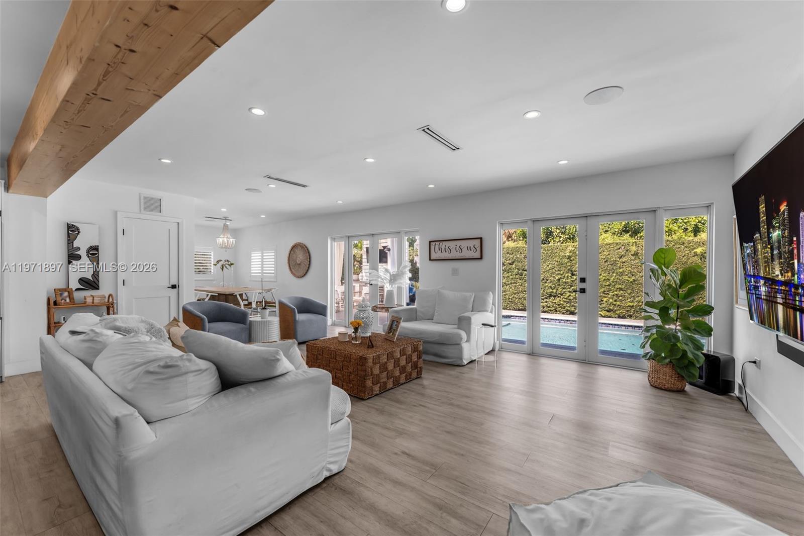 8311 Southwest 47th Street Miami, FL 33155 - Photo 16 of 48 a living room with furniture and a large window
