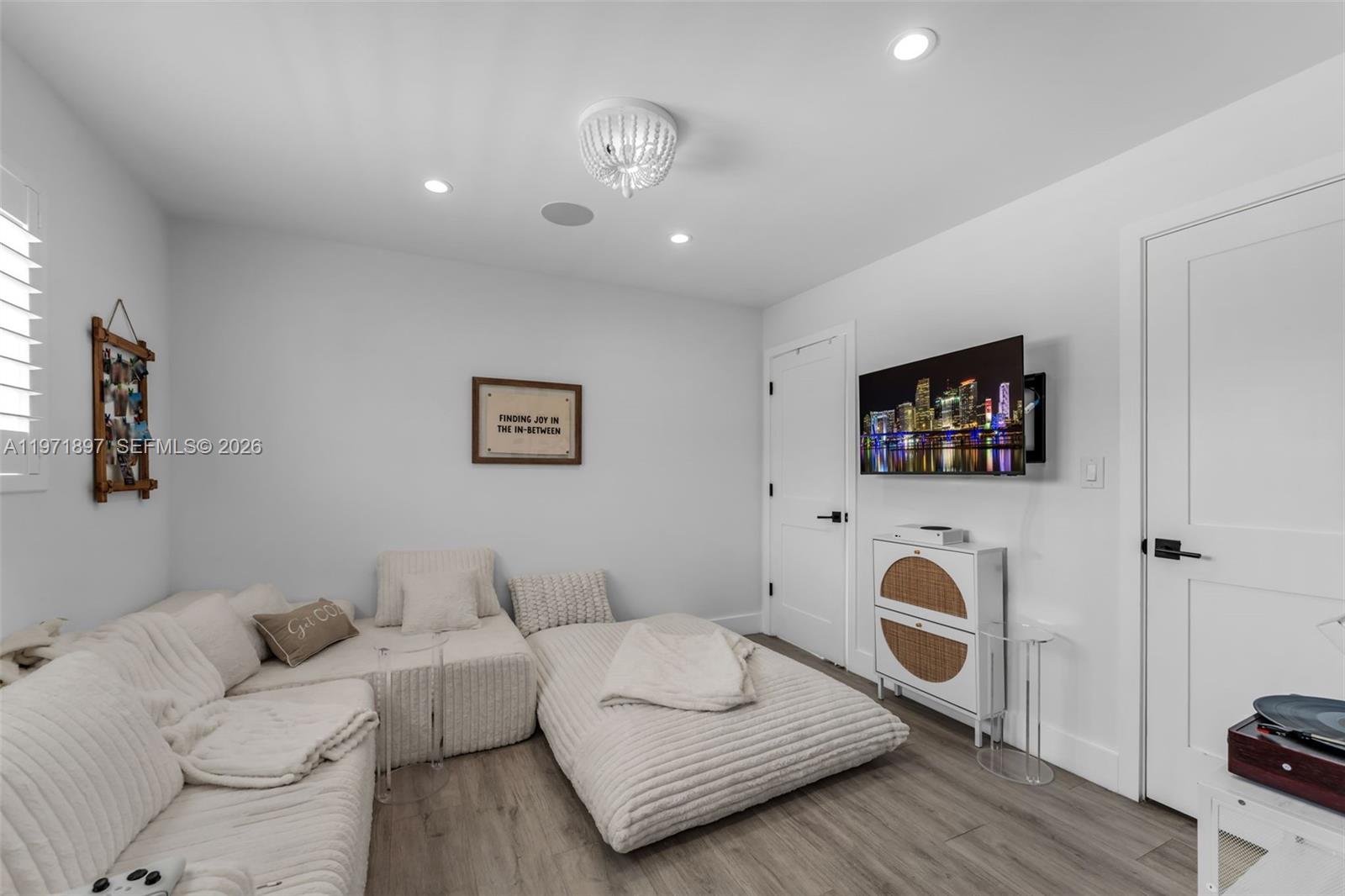 8311 Southwest 47th Street Miami, FL 33155 - Photo 19 of 48 a living room with furniture and a flat screen tv