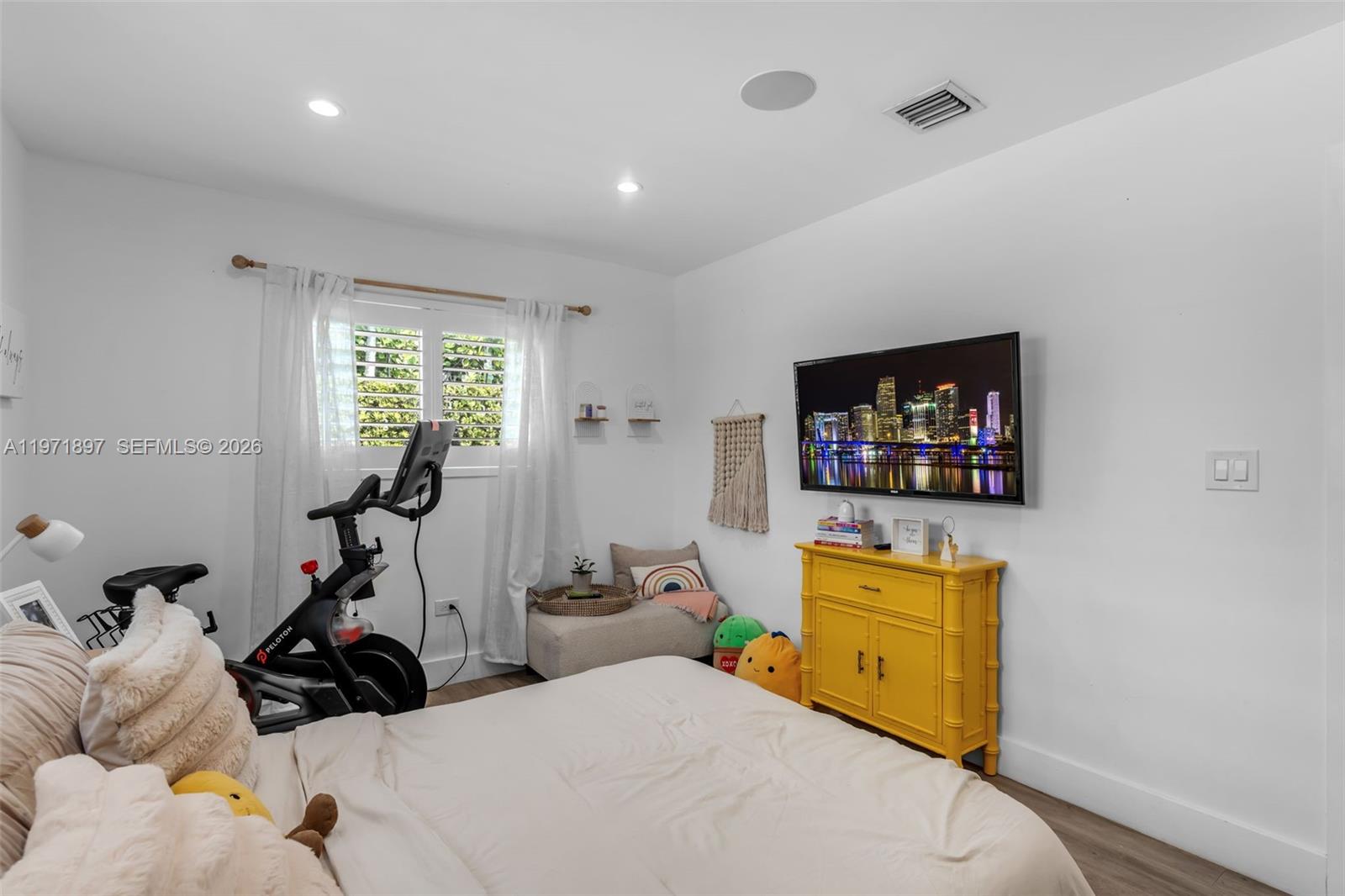8311 Southwest 47th Street Miami, FL 33155 - Photo 22 of 48 a bedroom with furniture and a flat screen tv