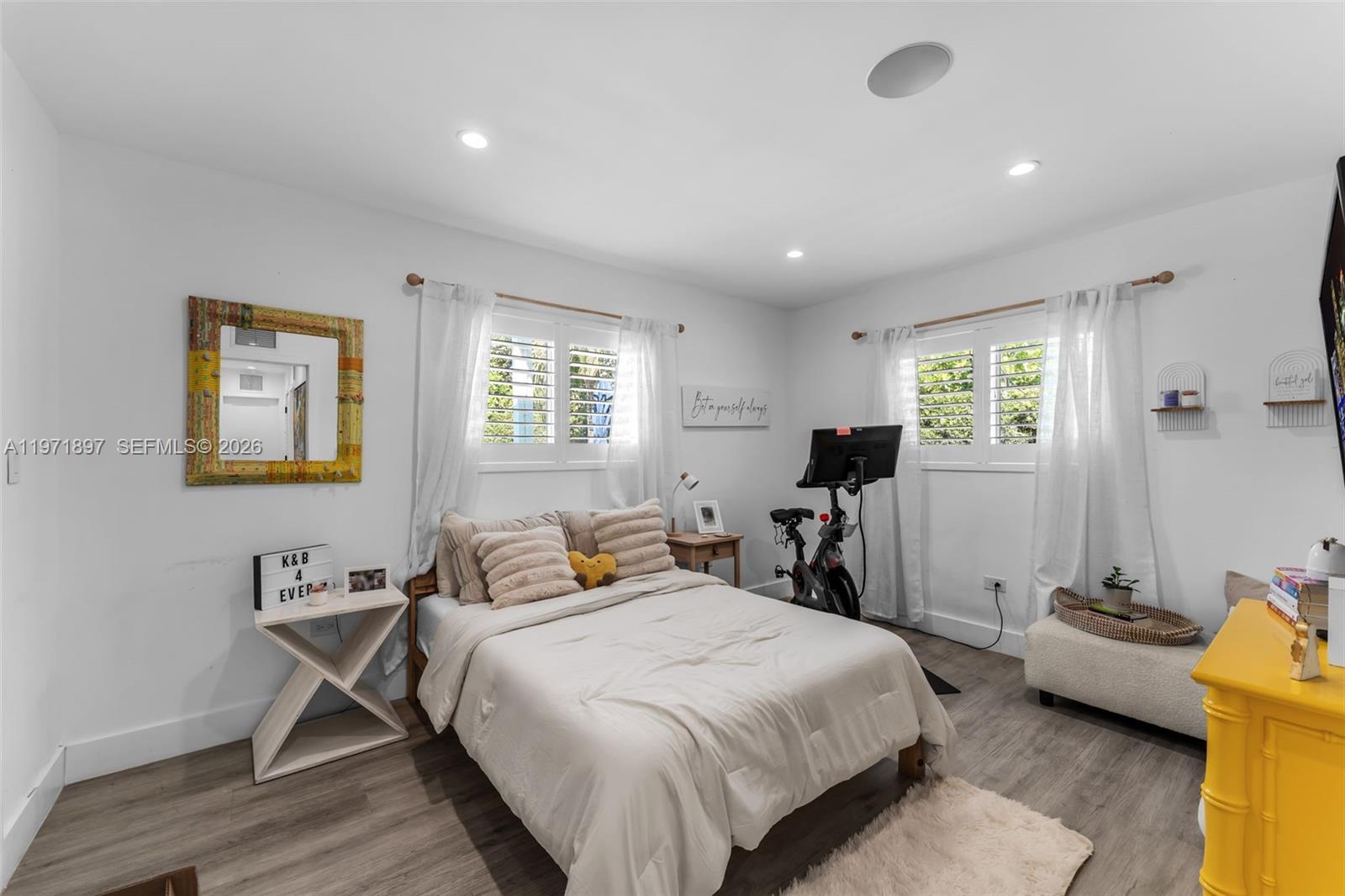 8311 Southwest 47th Street Miami, FL 33155 - Photo 23 of 48 a bedroom with a bed a table and chair