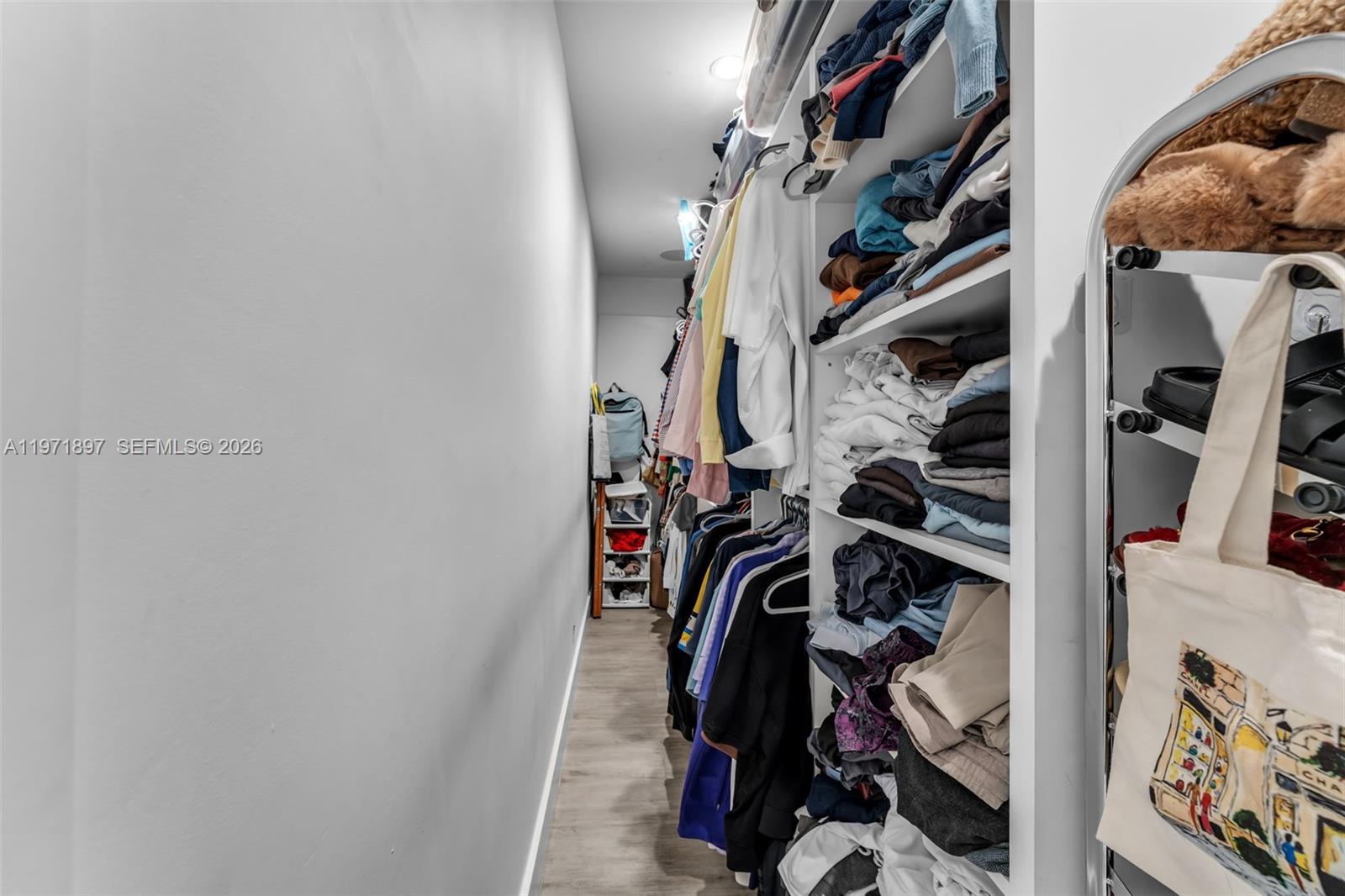 8311 Southwest 47th Street Miami, FL 33155 - Photo 29 of 48 a view of walk in closet with clothes and shoes