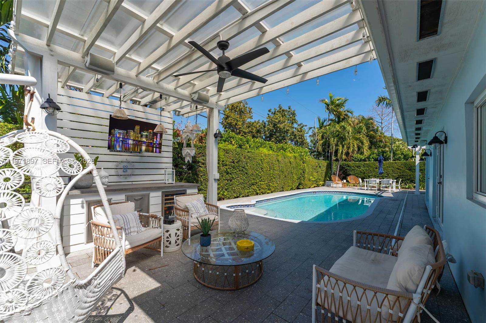 8311 Southwest 47th Street Miami, FL 33155 - Photo 31 of 48 a outdoor living space with furniture and a potted plant