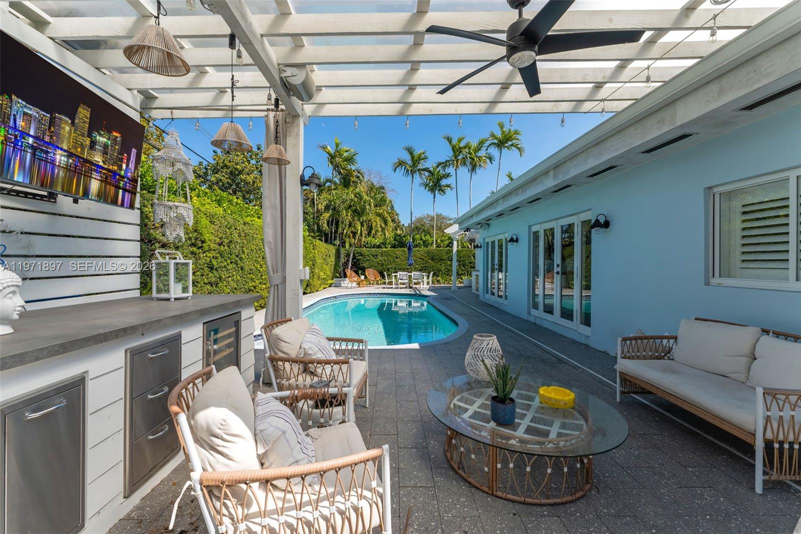 8311 Southwest 47th Street Miami, FL 33155 - Photo 32 of 48 a view of a patio with a dining table and chairs