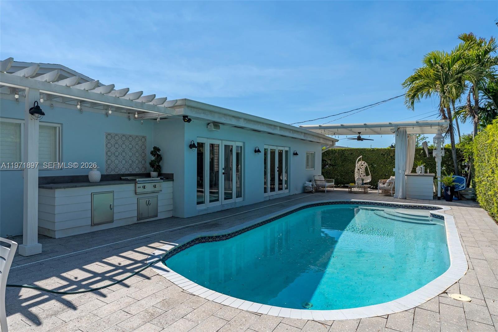 8311 Southwest 47th Street Miami, FL 33155 - Photo 34 of 48 a view of a house with swimming pool and sitting area