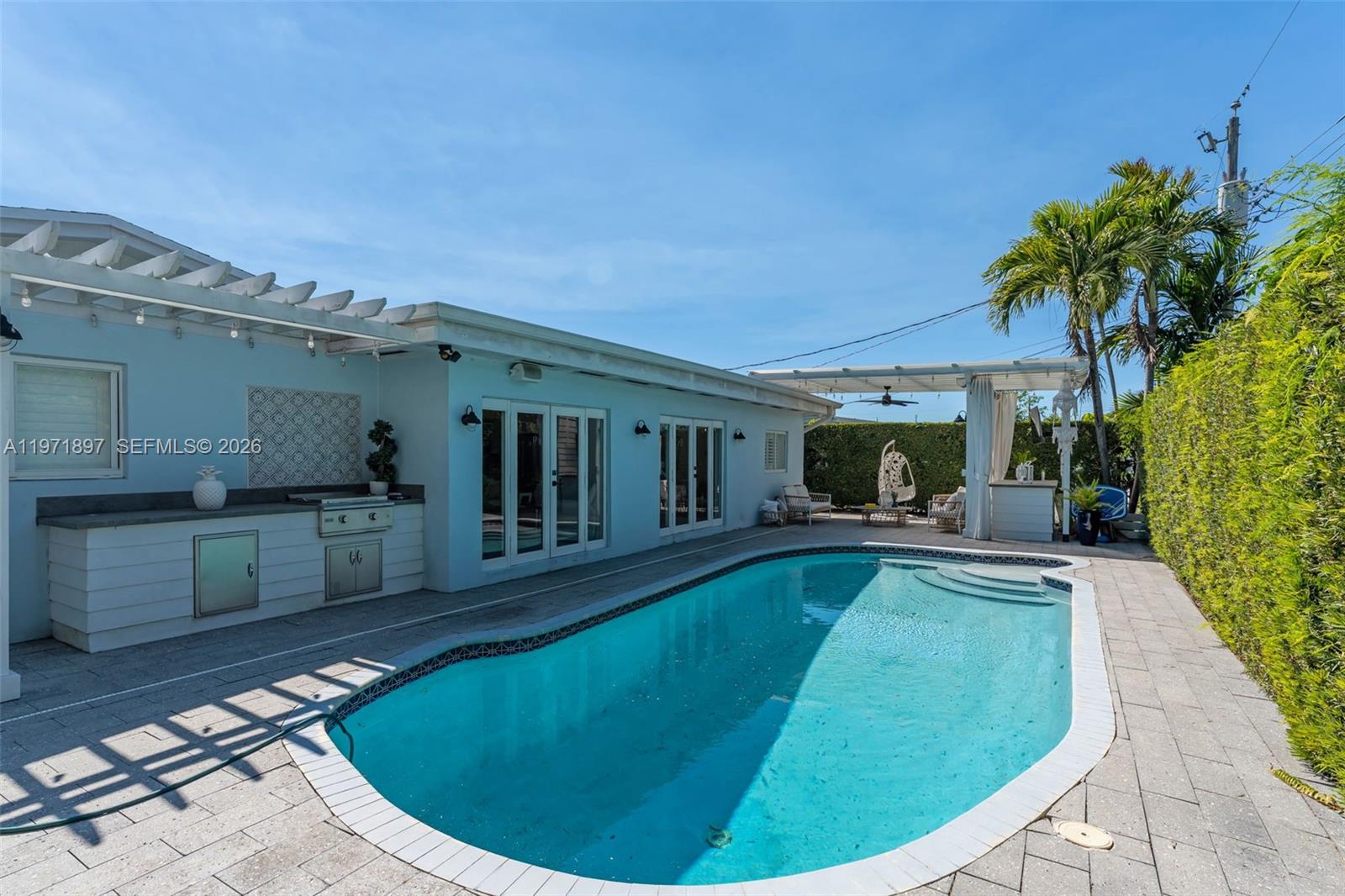 8311 Southwest 47th Street Miami, FL 33155 - Photo 35 of 48 a view of a house with swimming pool and sitting area