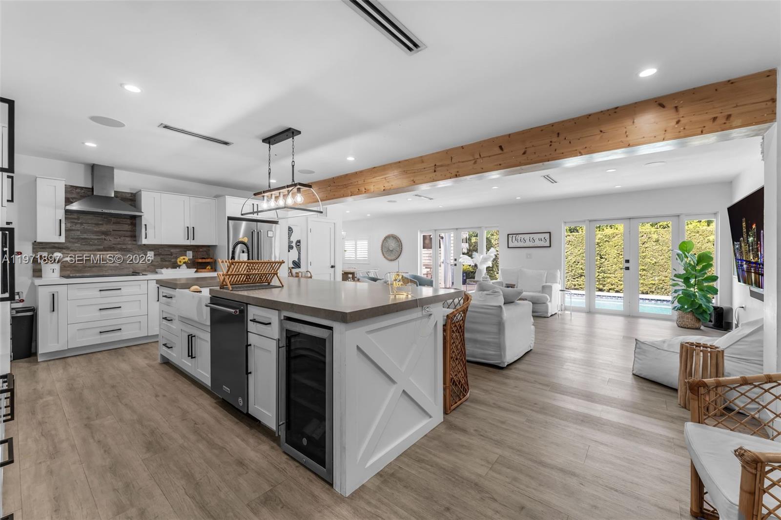 8311 Southwest 47th Street Miami, FL 33155 - Photo 5 of 48 a kitchen with sink cabinets and wooden floor