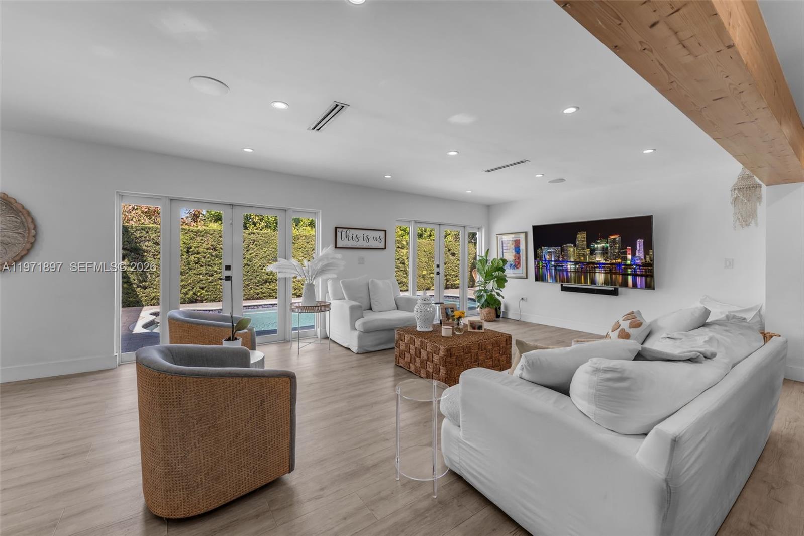 8311 Southwest 47th Street Miami, FL 33155 - Photo 10 of 48 a living room with furniture and a large window