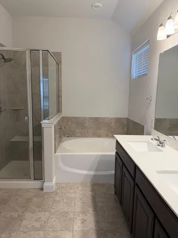 a bathroom with a bathtub and a sink