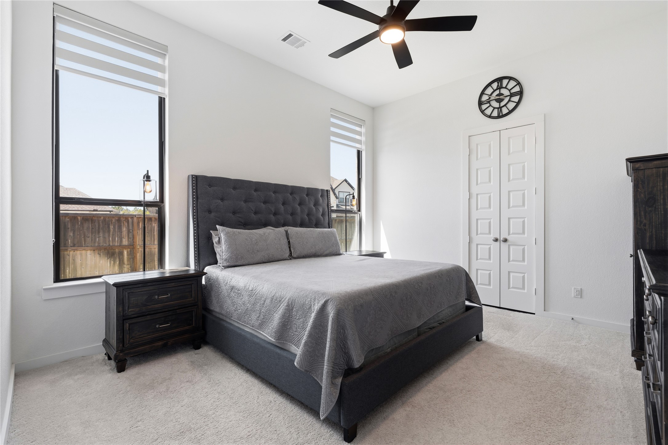 416 Bartlett Street Webster, TX 77598 - Photo 31 of 49 Guest suite with tufted bed, carpet, ceiling fan, and large windows