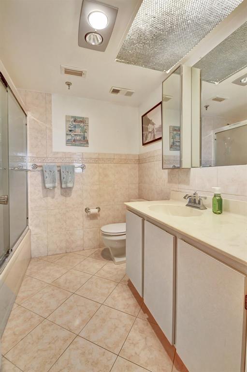 9220 Southwest 14th Street, Unit 3304 Boca Raton, FL 33428 - Photo 15 of 46 a spacious bathroom with a double vanity sink toilet and a shower