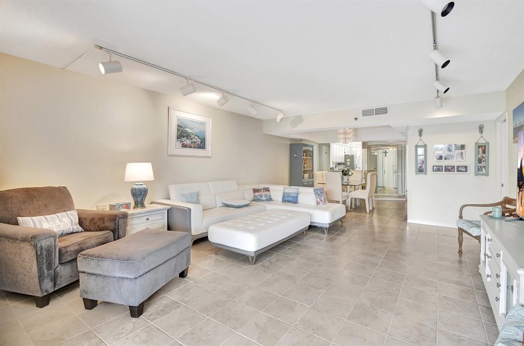 9220 Southwest 14th Street, Unit 3304 Boca Raton, FL 33428 - Photo 21 of 46 a living room with furniture and wooden floor