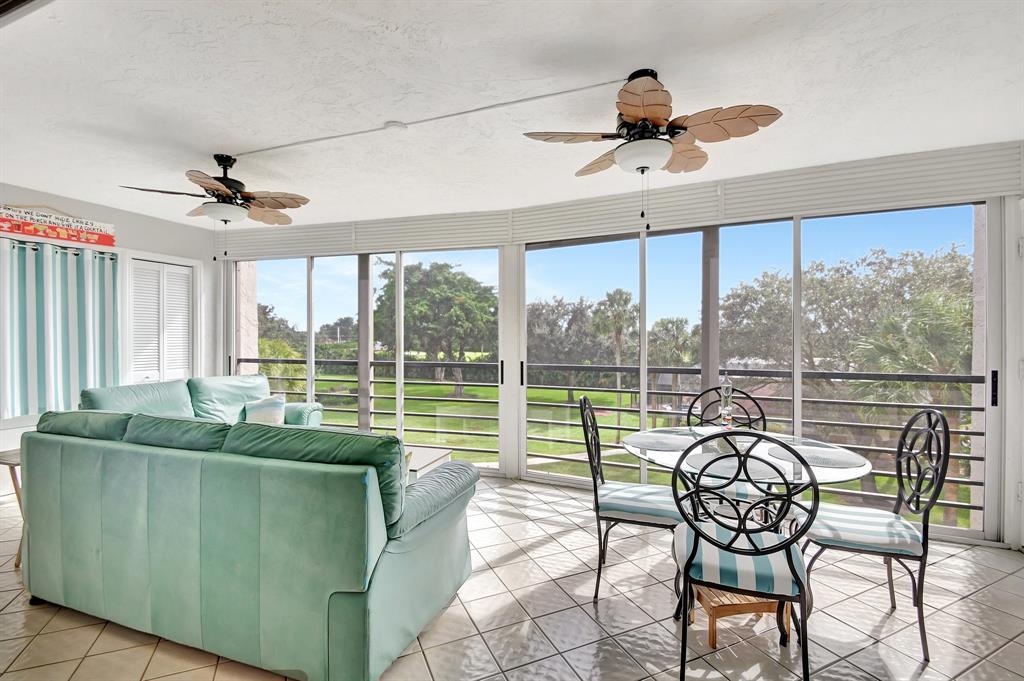 9220 Southwest 14th Street, Unit 3304 Boca Raton, FL 33428 - Photo 29 of 46 a living room with furniture and a large window