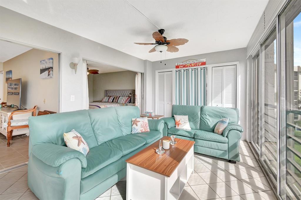 9220 Southwest 14th Street, Unit 3304 Boca Raton, FL 33428 - Photo 30 of 46 a living room with furniture and a large window