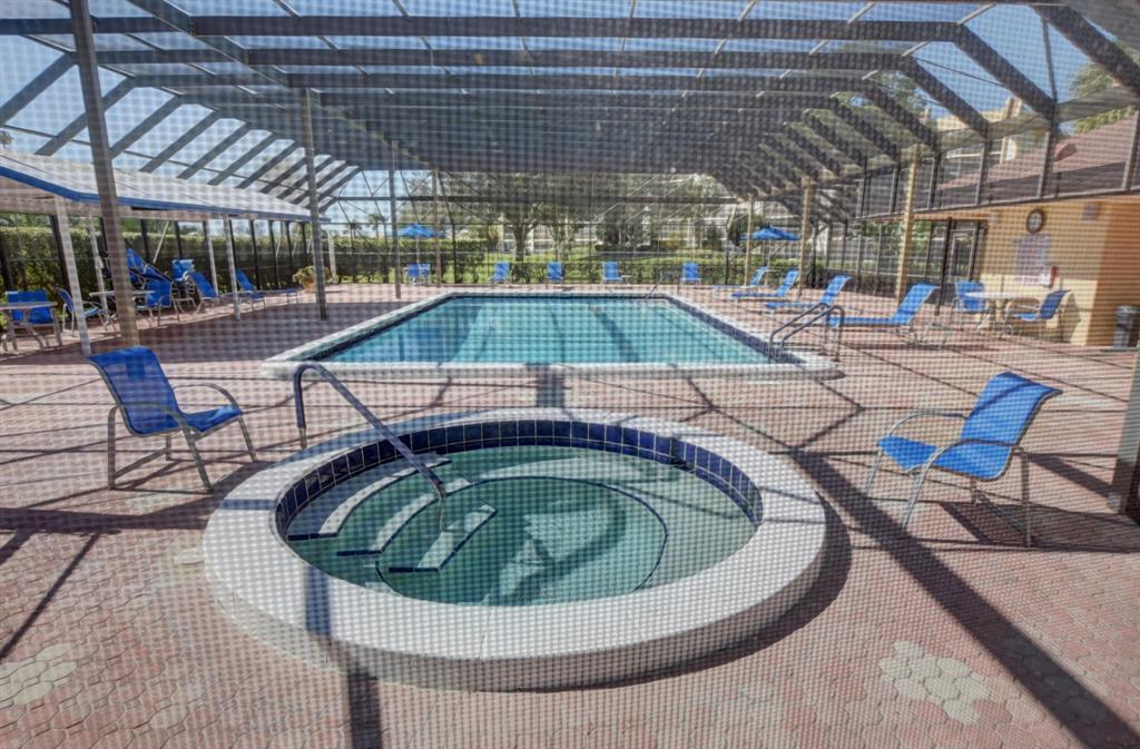 9220 Southwest 14th Street, Unit 3304 Boca Raton, FL 33428 - Photo 40 of 46 a view of a swimming pool with outdoor seating