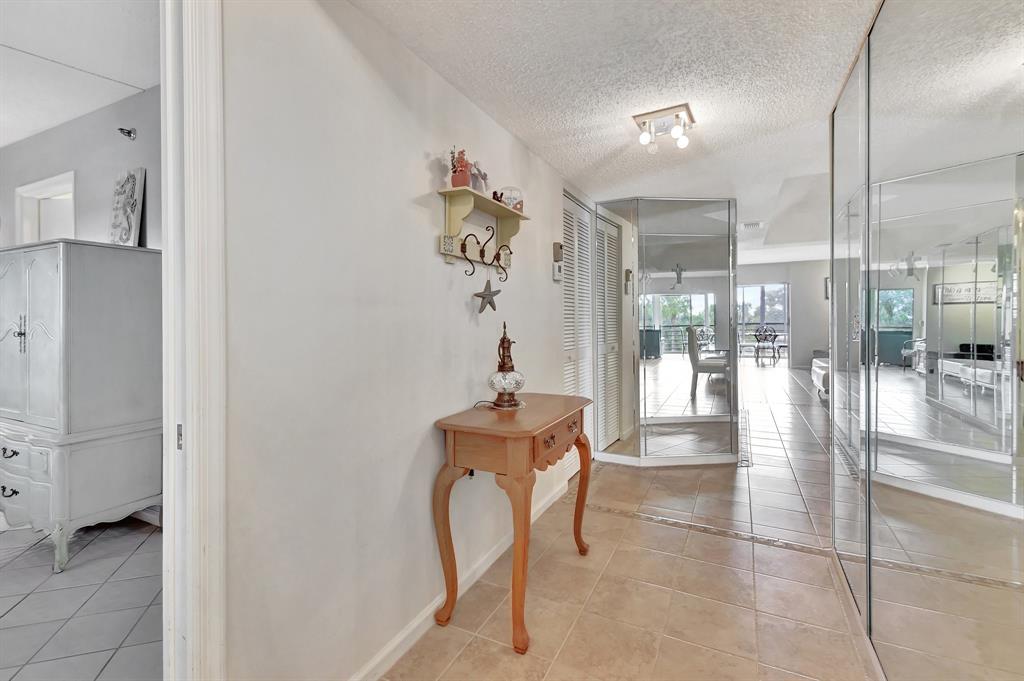 9220 Southwest 14th Street, Unit 3304 Boca Raton, FL 33428 - Photo 10 of 46 a room with table and gym equipment