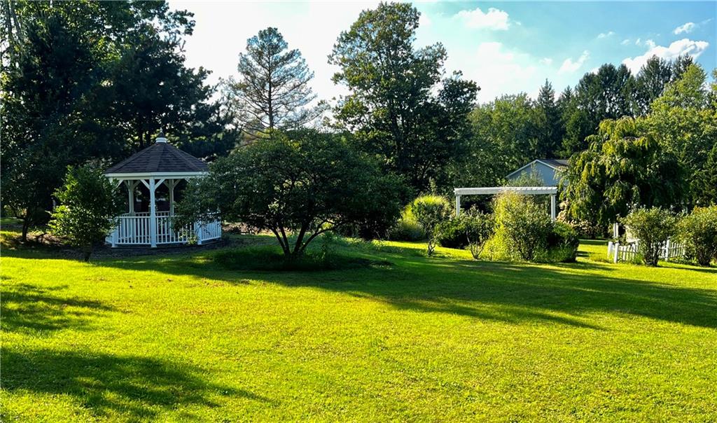 121 Sampson Drive Apollo, PA 15613 - Photo 17 of 33 a view of a swimming pool and trees in the background