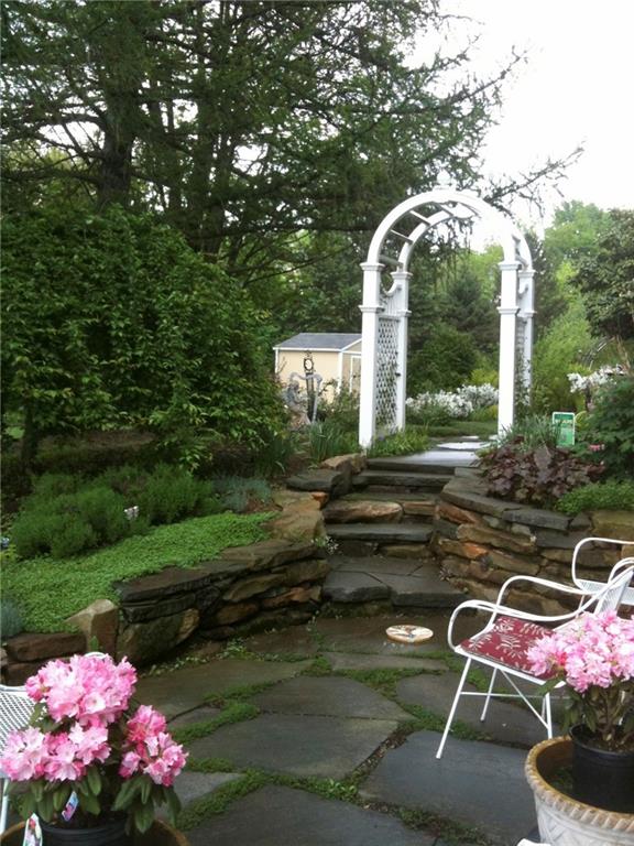 121 Sampson Drive Apollo, PA 15613 - Photo 22 of 33 a front view of a house with garden