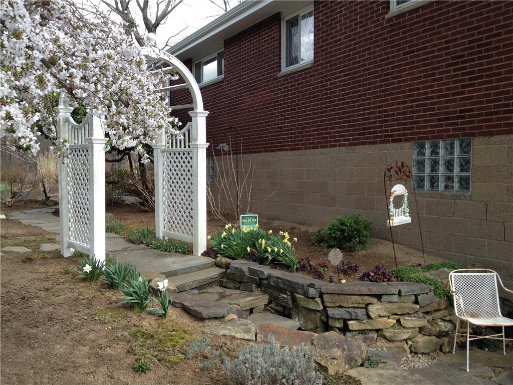 121 Sampson Drive Apollo, PA 15613 - Photo 28 of 33 a backyard of a house with outdoor seating