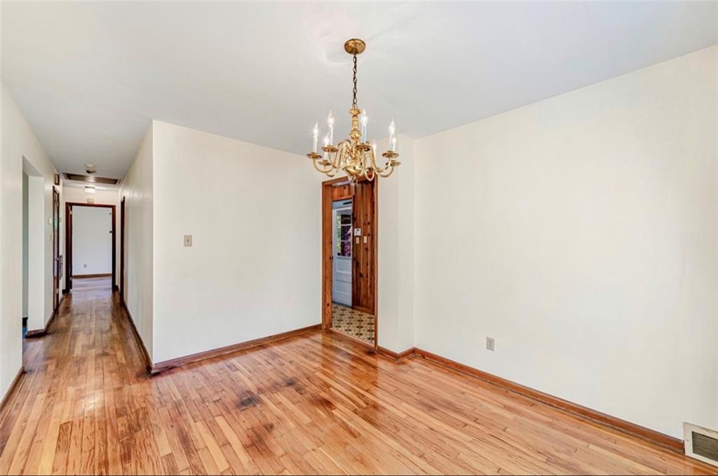 121 Sampson Drive Apollo, PA 15613 - Photo 7 of 33 a view of a room with wooden floor and chandelier