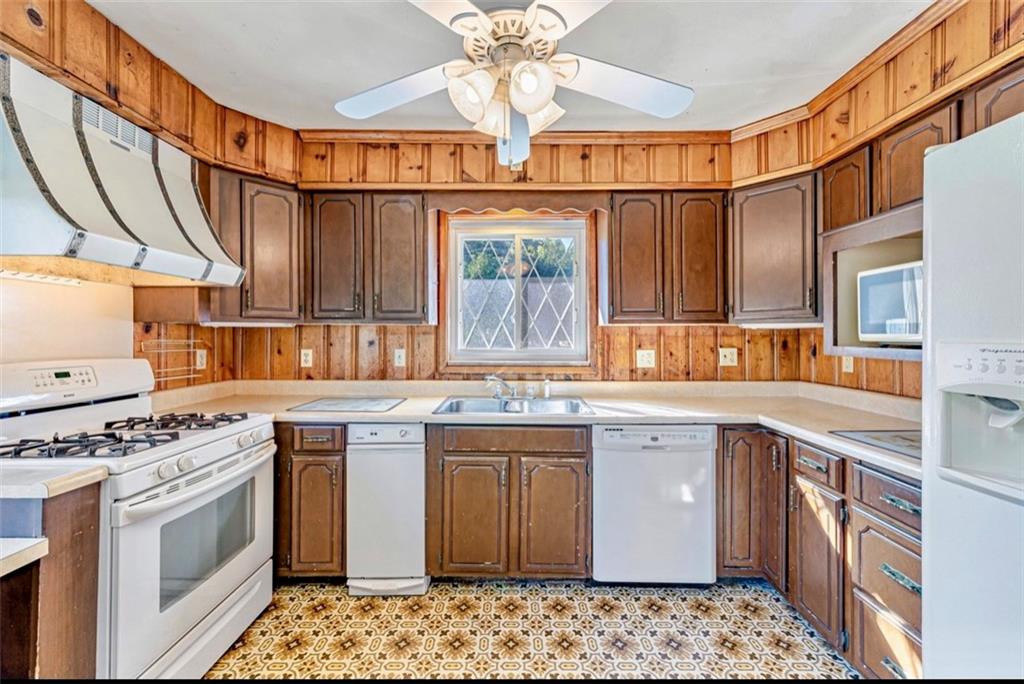 121 Sampson Drive Apollo, PA 15613 - Photo 10 of 33 a kitchen with stainless steel appliances granite countertop a sink stove and refrigerator