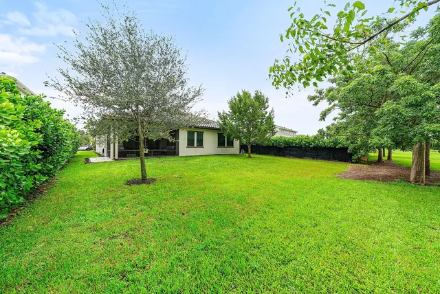an aerial view of a house with a garden
