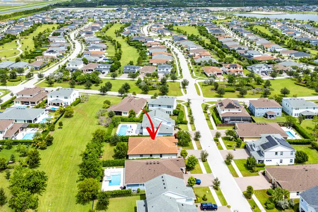 an aerial view of residential houses with outdoor space
