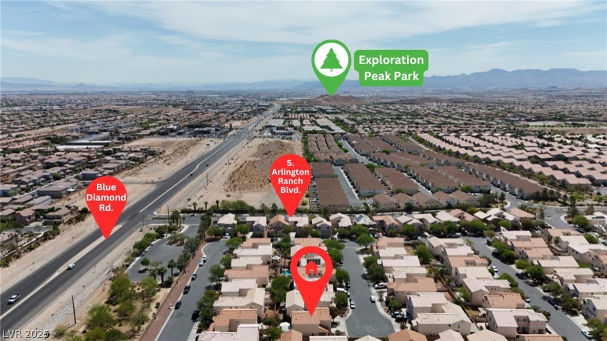 8934 Deep Ridge Court Las Vegas, NV 89178 - Photo 39 of 47 An aerial perspective showcases a vibrant community with proximity to a major road and natural recreation.