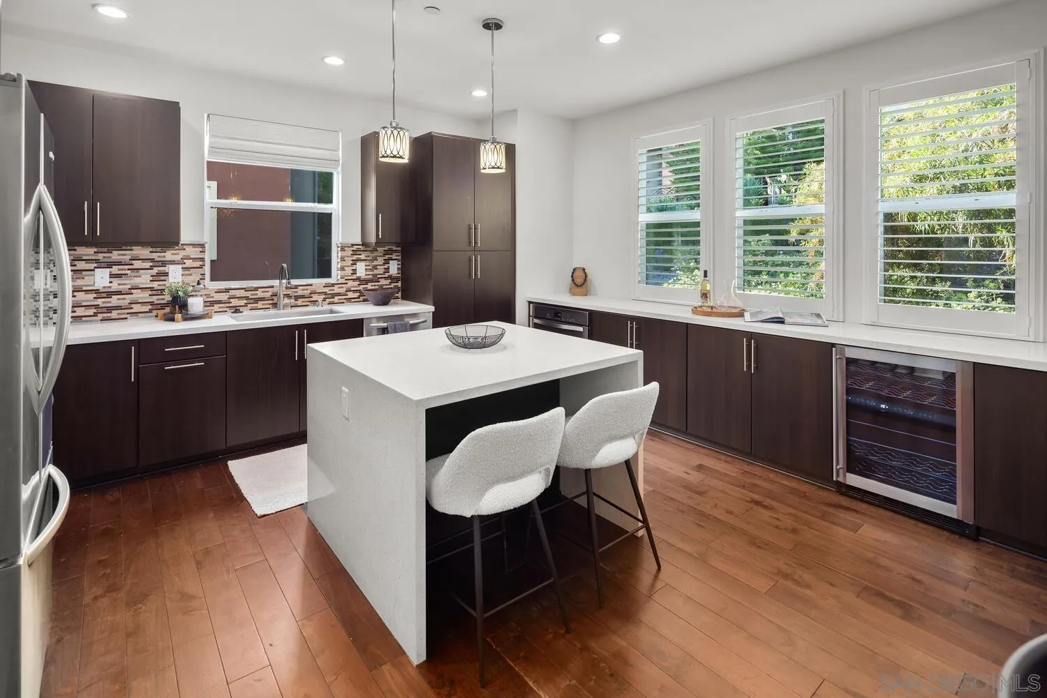 7830 Inception Way San Diego, CA 92108 - Photo 1 of 37 a kitchen with stainless steel appliances granite countertop a table chairs sink refrigerator and microwave