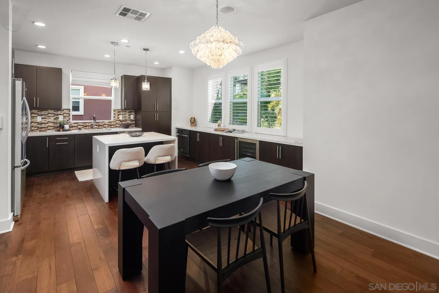 7830 Inception Way San Diego, CA 92108 - Photo 14 of 37 a kitchen with a table and chairs in it
