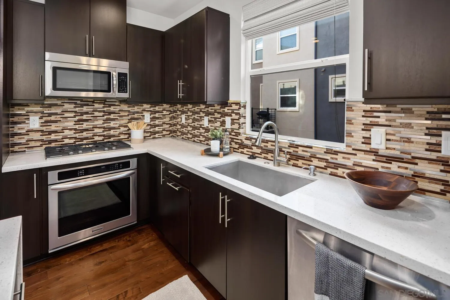 7830 Inception Way San Diego, CA 92108 - Photo 17 of 37 a kitchen with a sink and stainless steel appliances