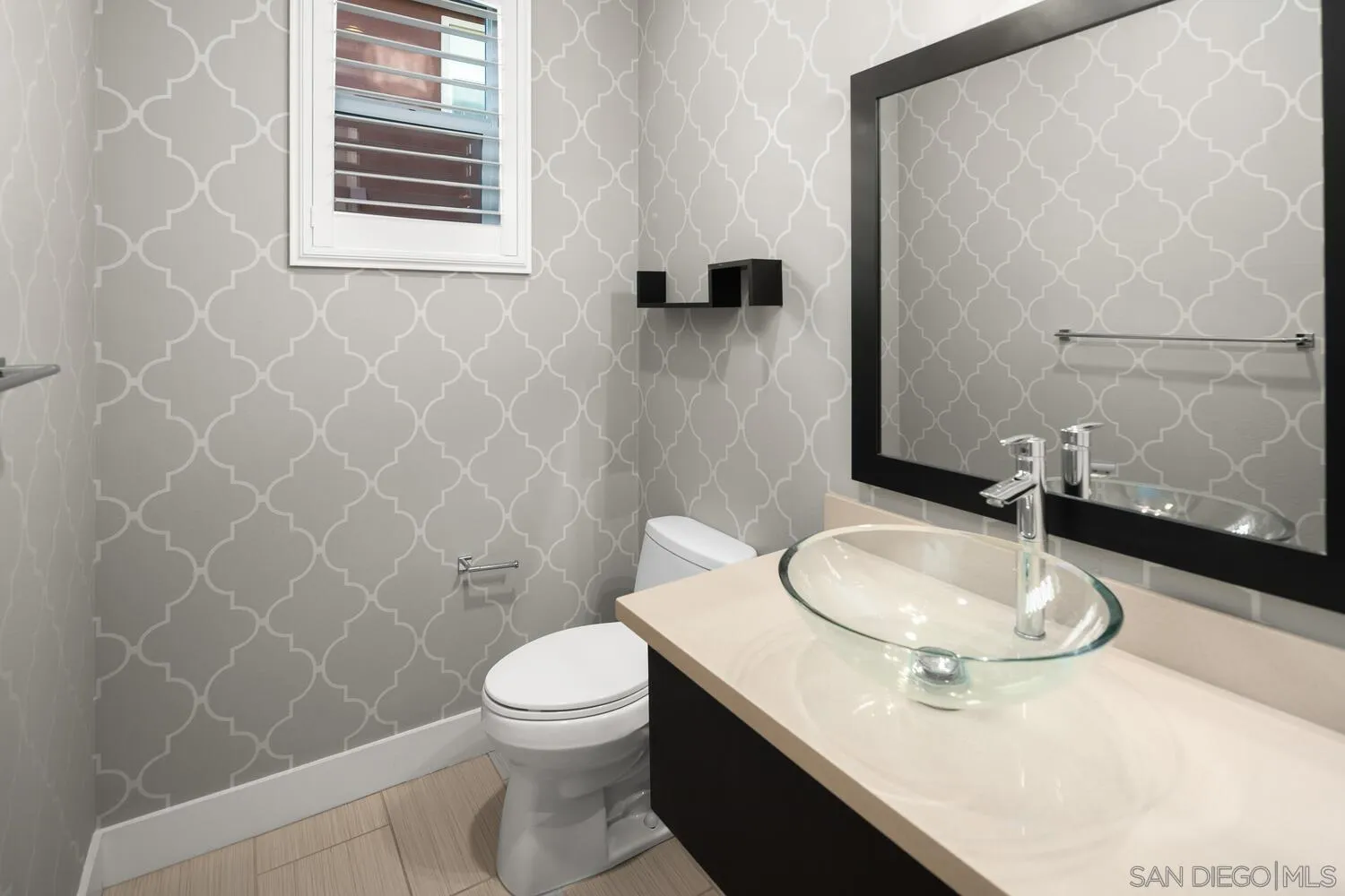 7830 Inception Way San Diego, CA 92108 - Photo 19 of 37 a bathroom with a sink a toilet and a mirror