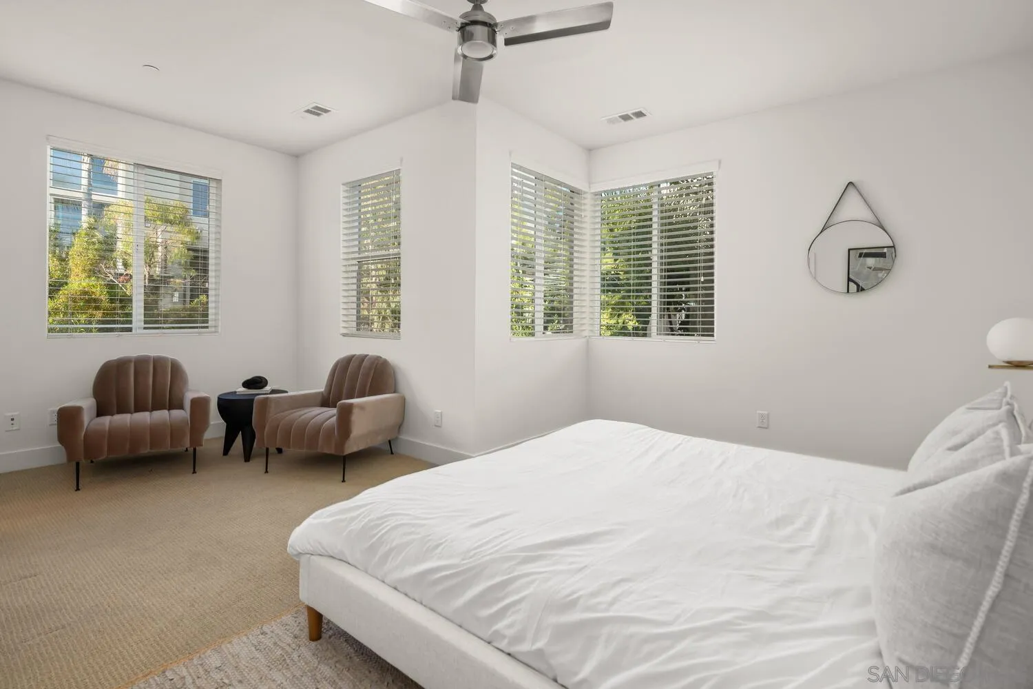 7830 Inception Way San Diego, CA 92108 - Photo 23 of 37 a bedroom with bed couch and window