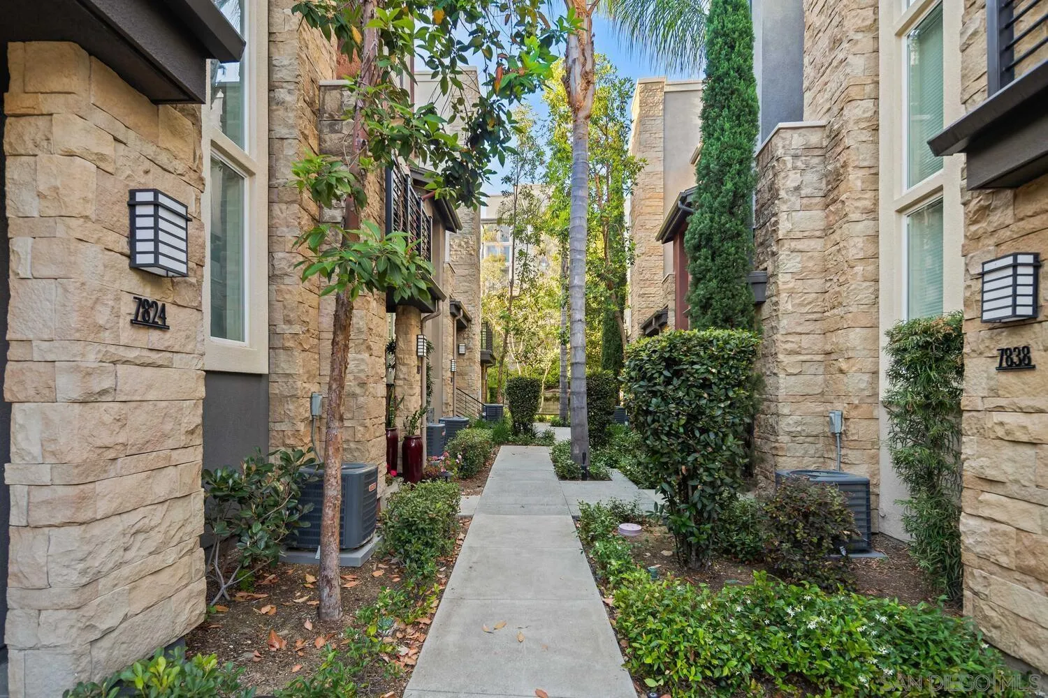 7830 Inception Way San Diego, CA 92108 - Photo 3 of 37 a view of a pathway along the building