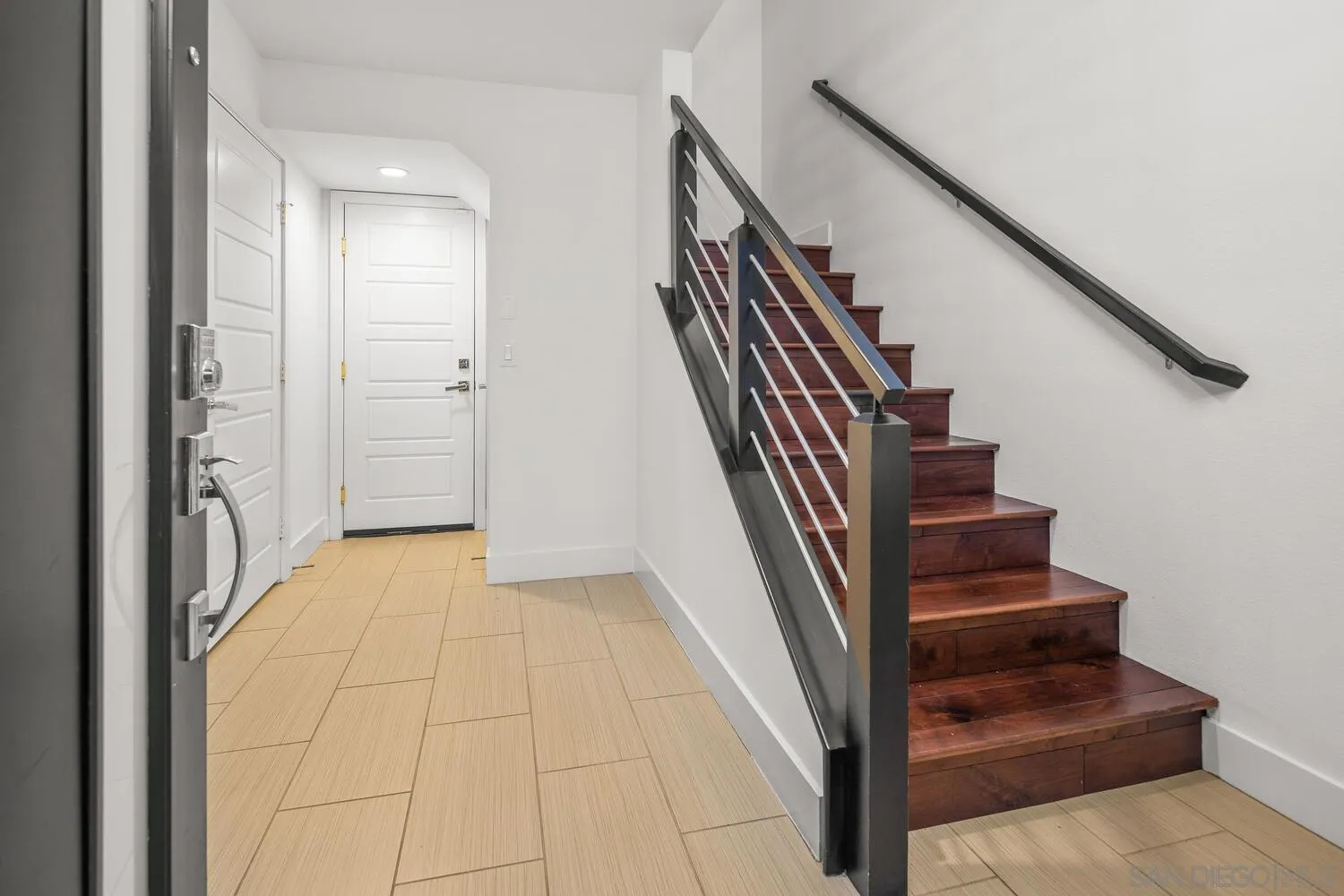 7830 Inception Way San Diego, CA 92108 - Photo 6 of 37 a view of entryway and hall with wooden floor