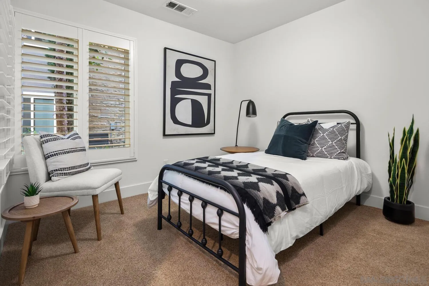 7830 Inception Way San Diego, CA 92108 - Photo 7 of 37 a bedroom with a bed and a chair